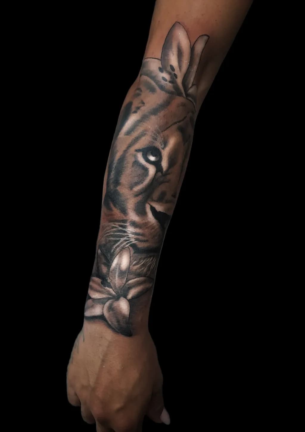 Majestic Ink: A Tiger's Gaze Amidst Floral Elegance