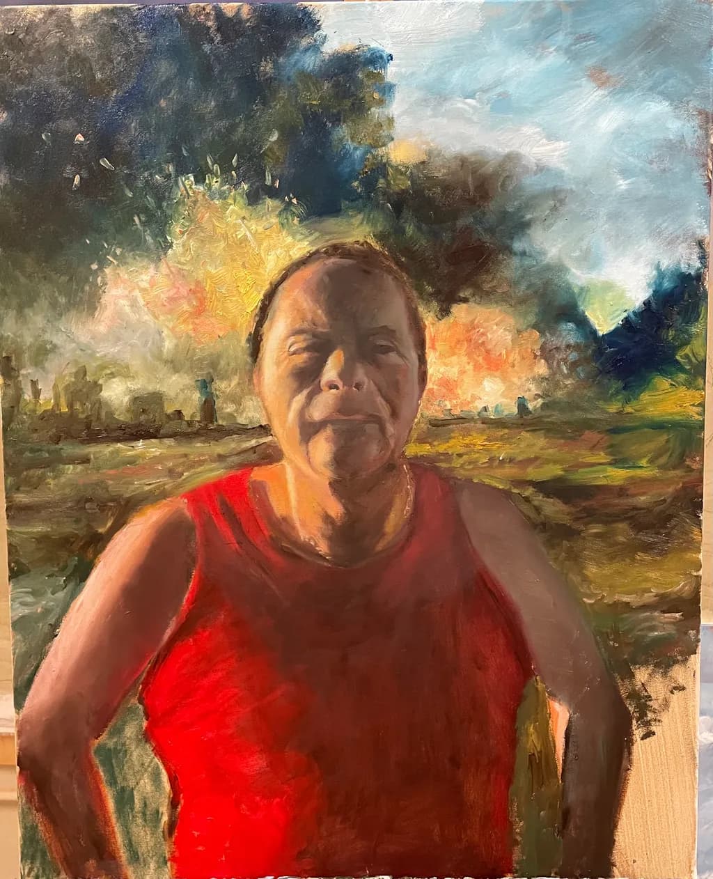 Resilience in Red: A Portrait of Strength Against a Fiery Horizon