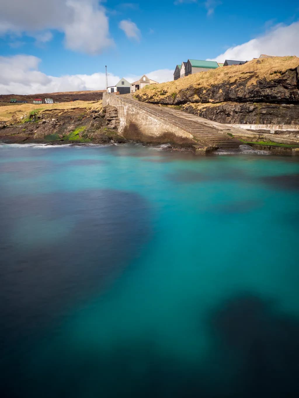 Serene Coastal Escape: A Tranquil Journey Through Vibrant Waters and Rustic Charm