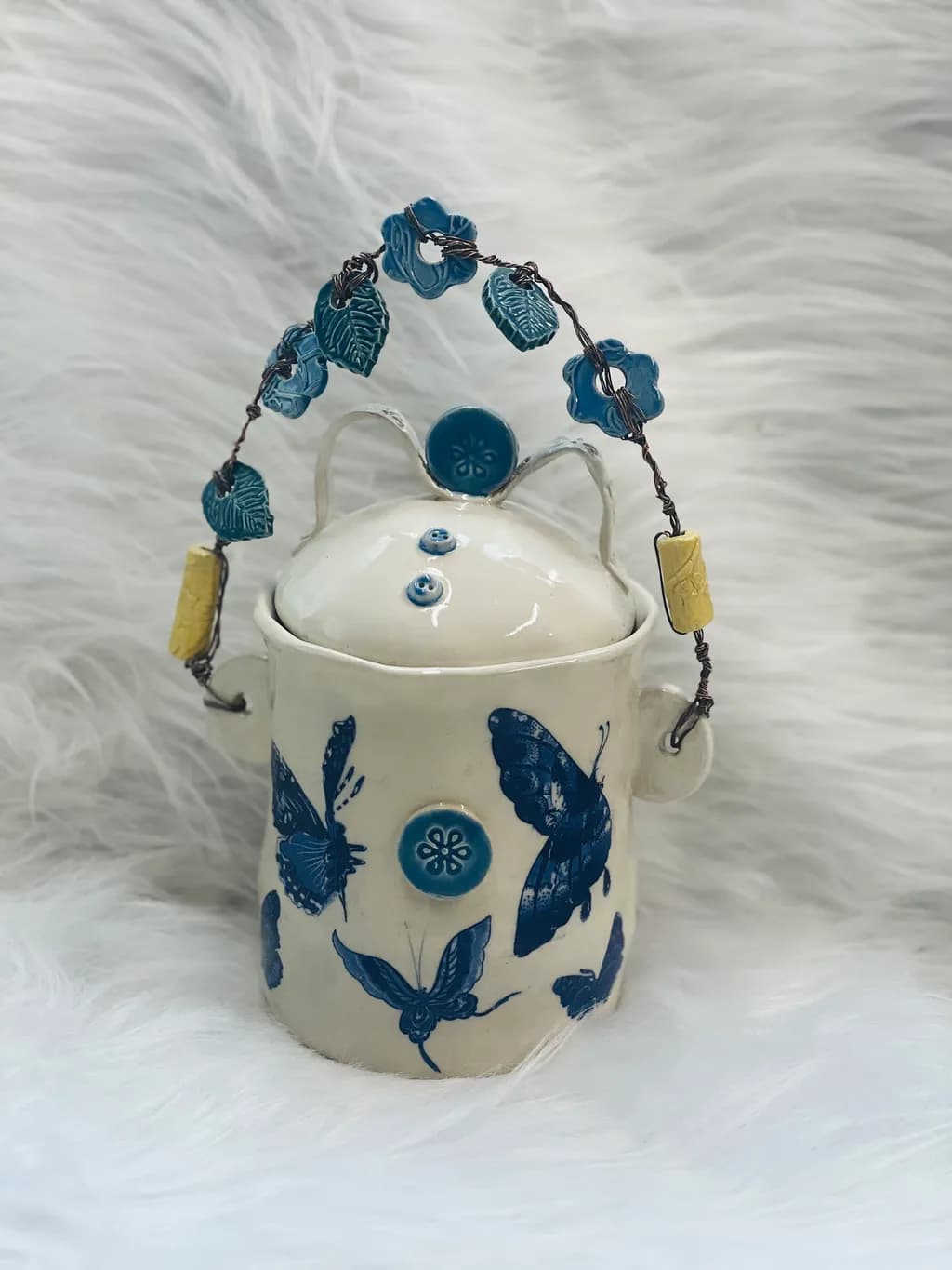 Whimsical Butterfly Adorned Ceramic Container with Floral Handle