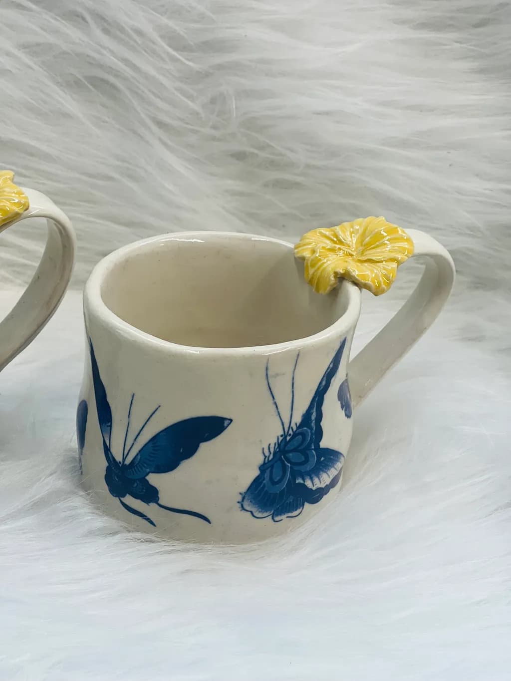 Whimsical Butterfly Mug with Yellow Floral Accent – Handcrafted Ceramic Artistry