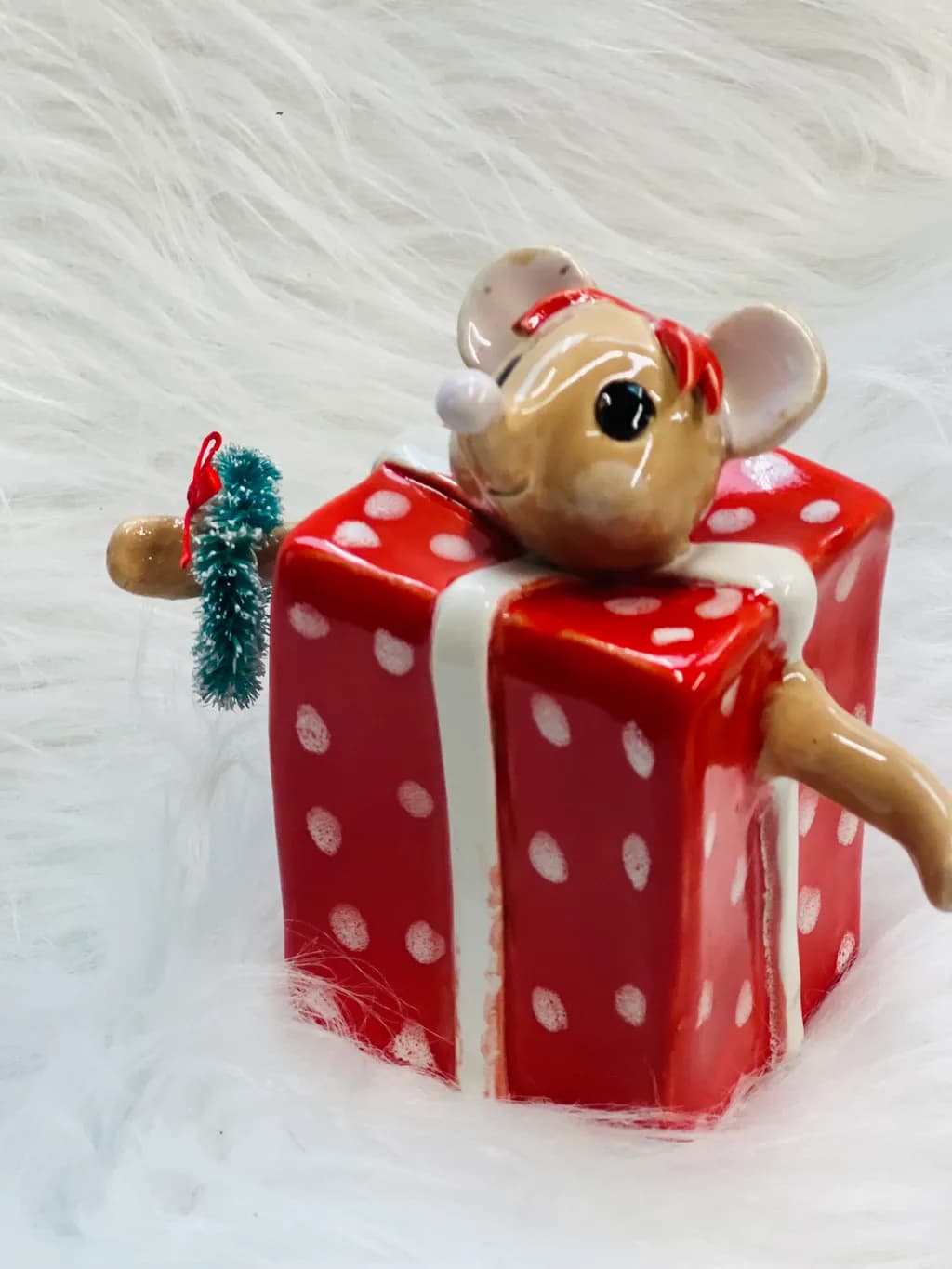 Whimsical Holiday Cheer: A Playful Mouse on a Festive Gift Box