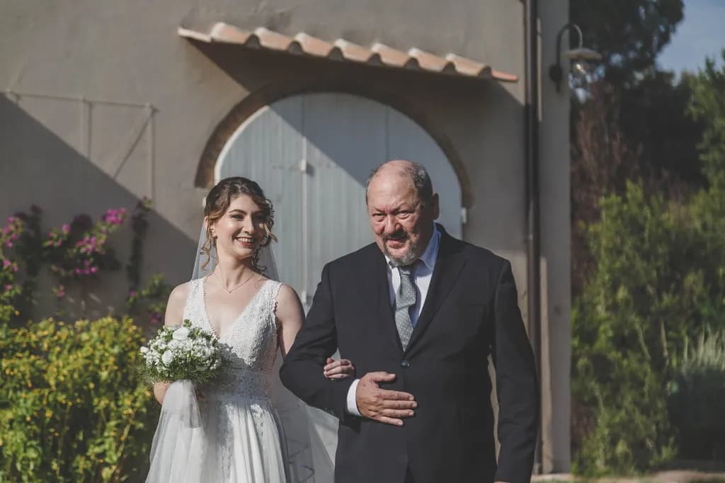 Joyful Moments: A Bride's Radiant Walk with Her Father on a Beautiful Day