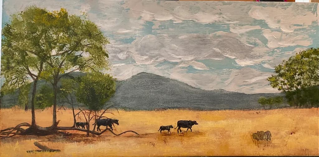 Serene Pastoral Harmony: Cows Grazing Under a Vast Sky