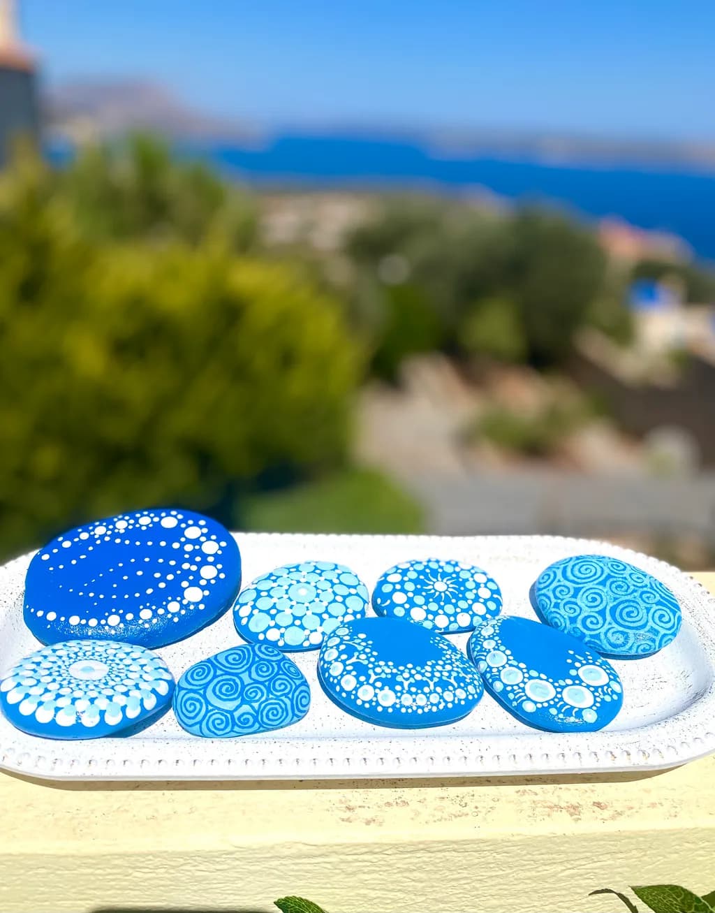 Oceanic Harmony: A Collection of Blue Decorative Stones with Coastal Patterns