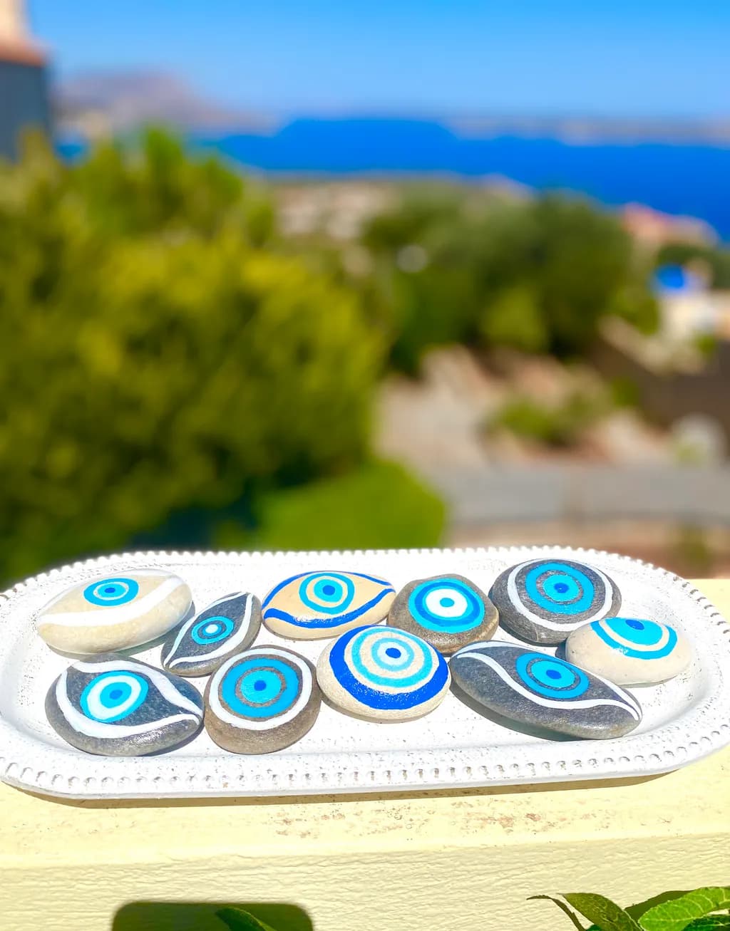Coastal Harmony: Hand-Painted Blue Ceramic Stones for Decorative Elegance