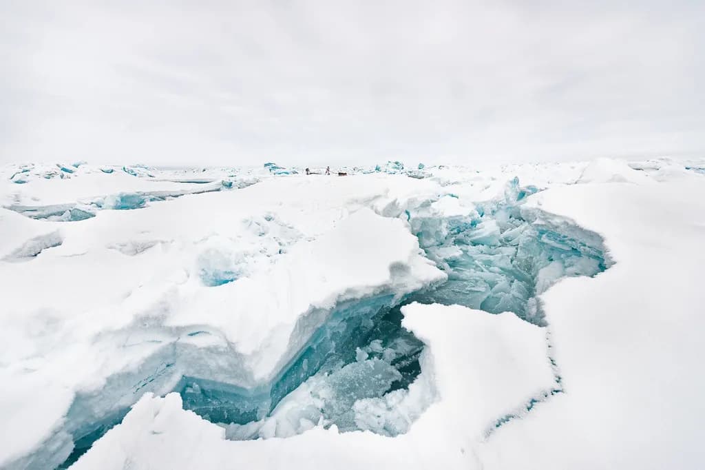 Frozen Serenity: A Glacial Landscape of Arctic Whiteness and Cracks in Time