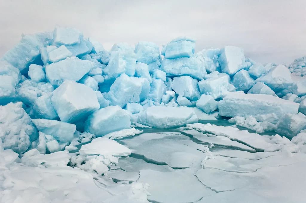Frozen Serenity: A Glacial Landscape of Crystal Blue Ice and Textured Beauty