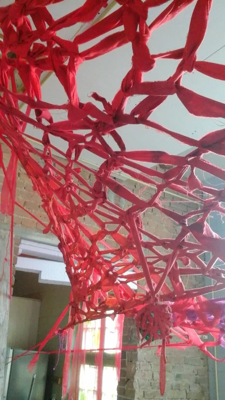 Crimson Threads: An Abstract Textile Installation Exploring Creative Boundaries