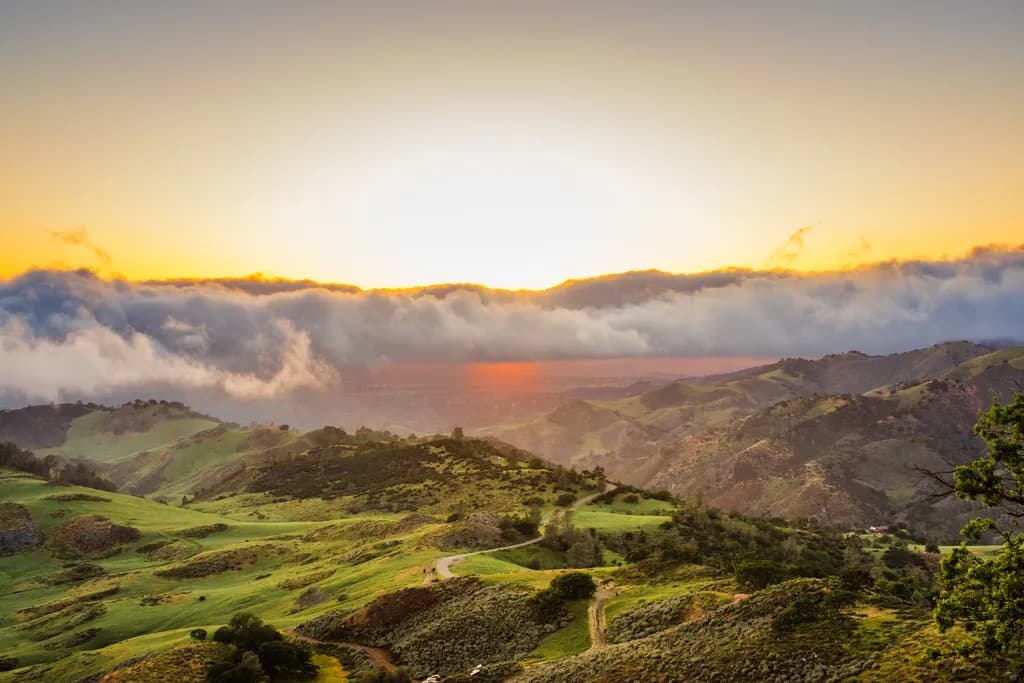 Whispers of Dawn: A Serene Landscape Awakens Under a Golden Horizon