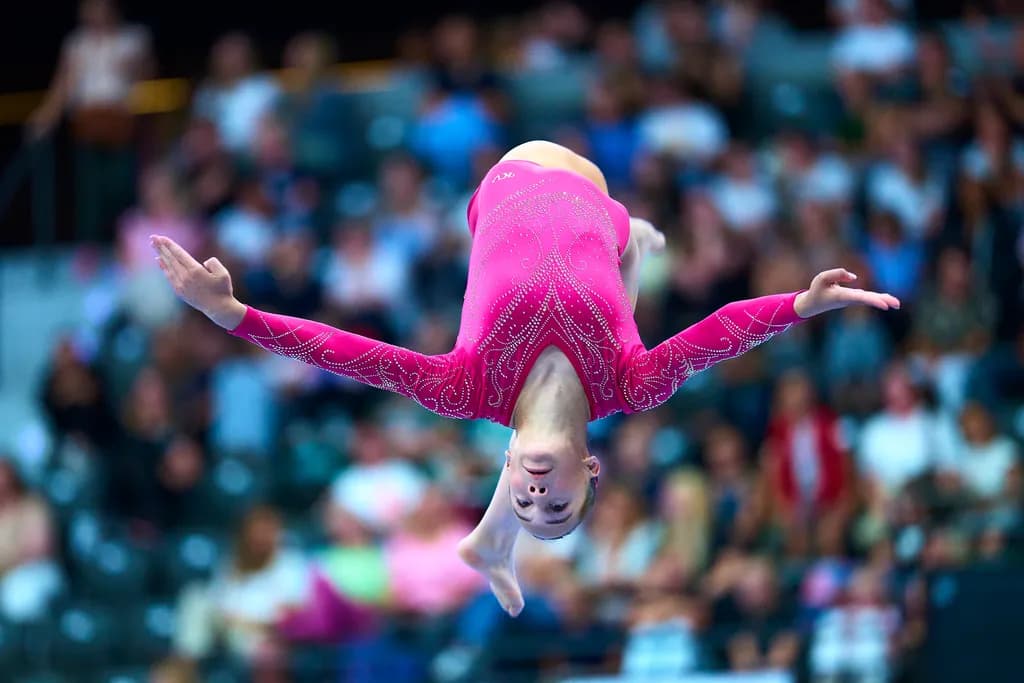 Grace in Motion: A Daring Gymnast's Leap into the Spotlight