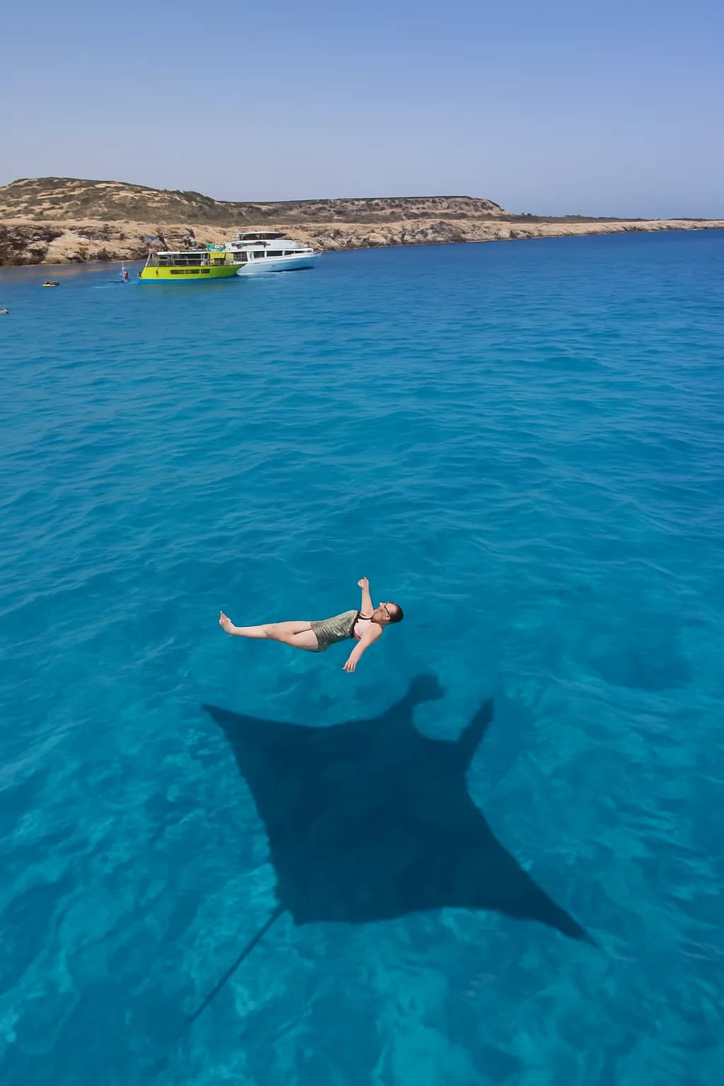 Serenity Beneath the Surface: A Dance with Shadows in Crystal Waters