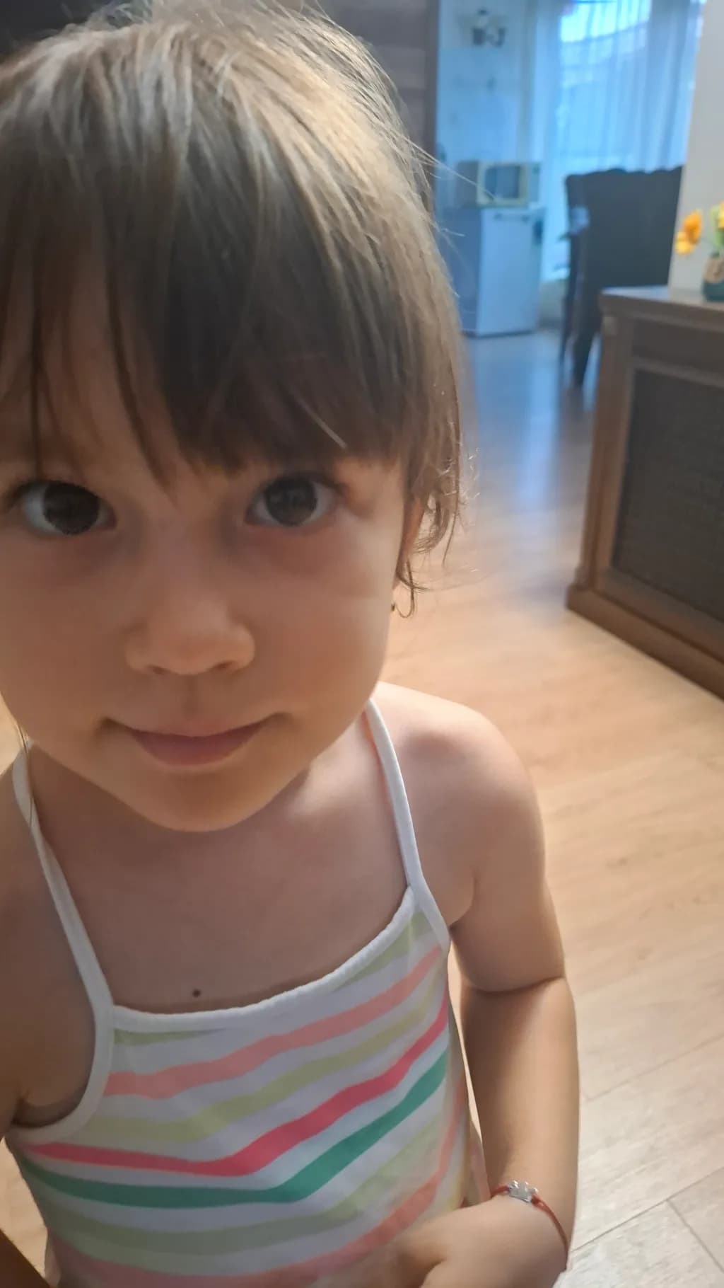 Whispers of Innocence: A Child's Gaze in a Sunlit Room