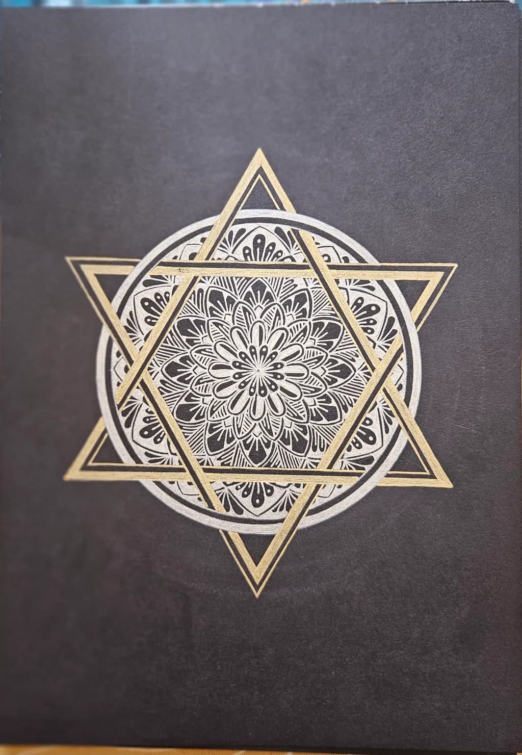 Golden Geometric Mandala: A Starry Dance on Black Canvas