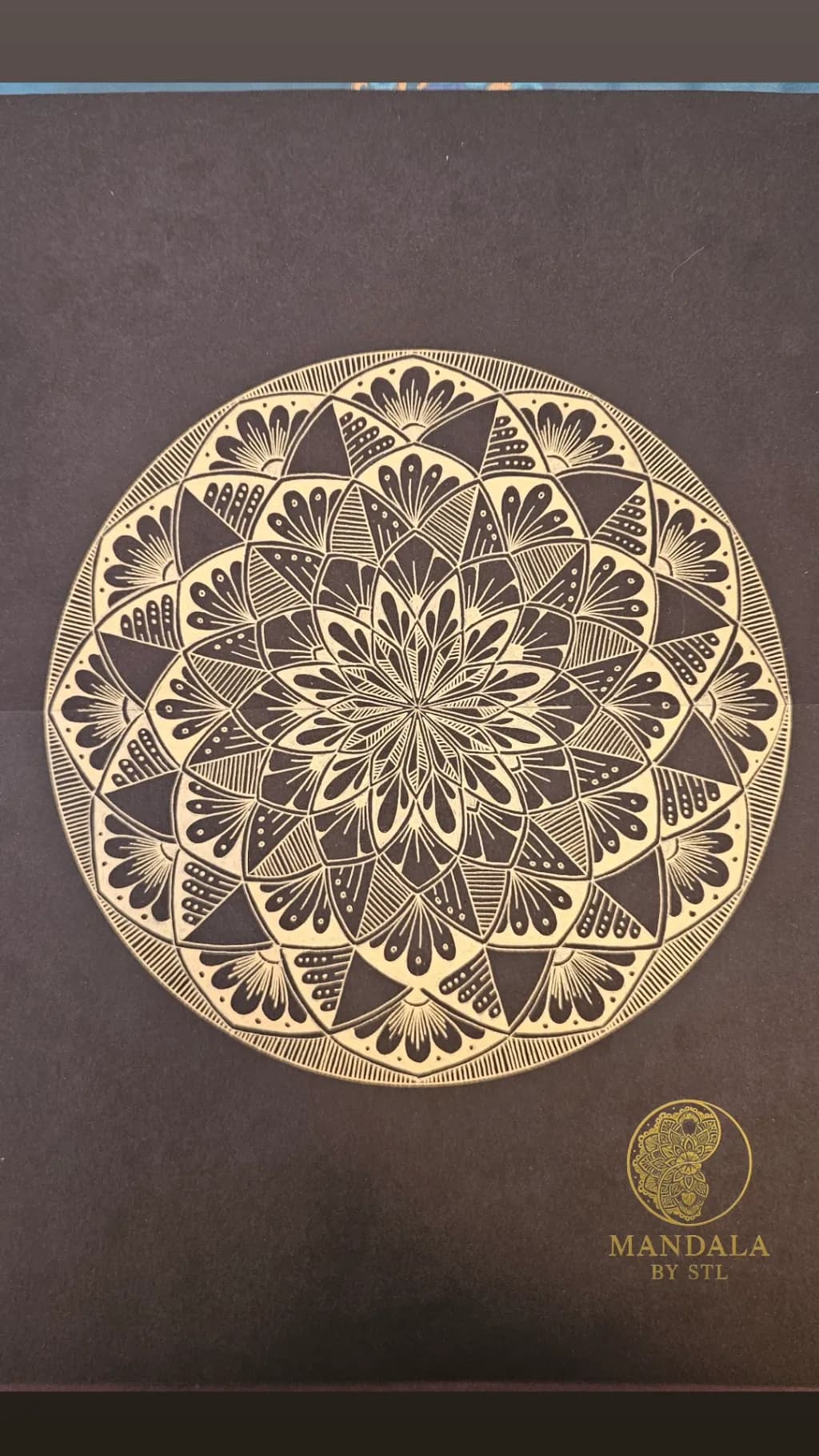 Golden Harmony: Intricate Mandala Design on Black Canvas