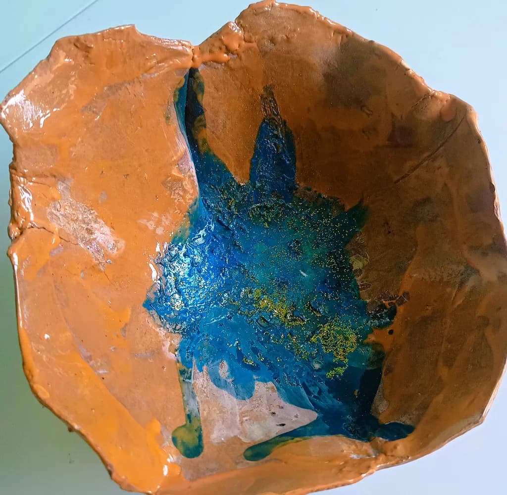 Ceramic Harmony: A Textured Dance of Blue and Earthy Tones in Handmade Artistry