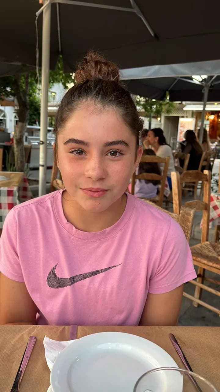 Capturing Youthful Serenity: A Moment of Anticipation at the Table