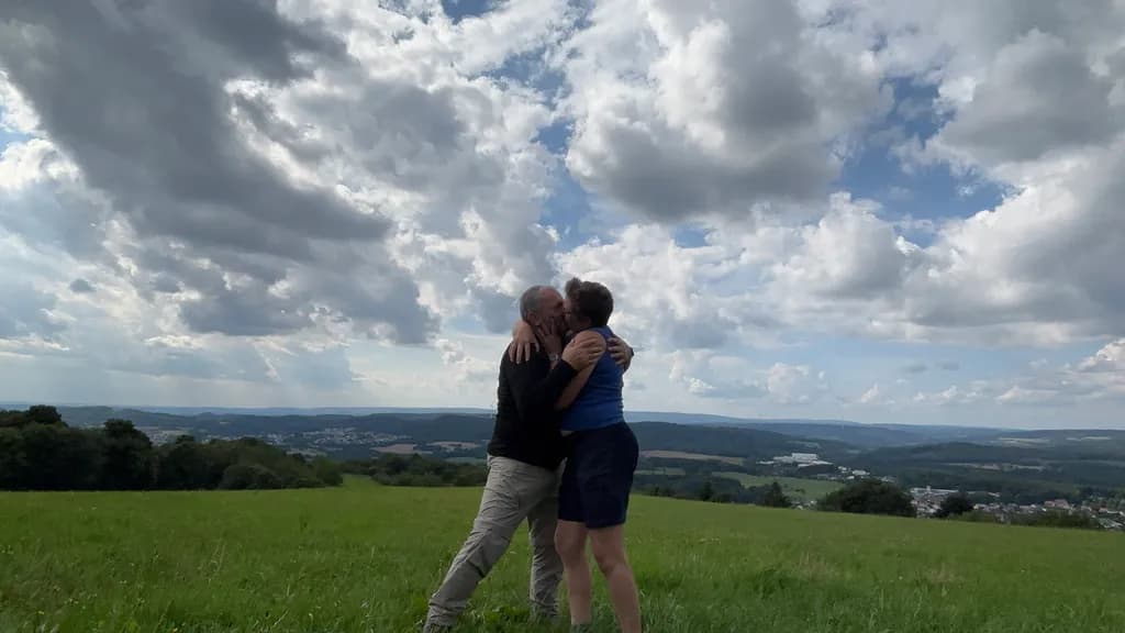 Embrace Under the Sky: A Moment of Love in Nature's Embrace