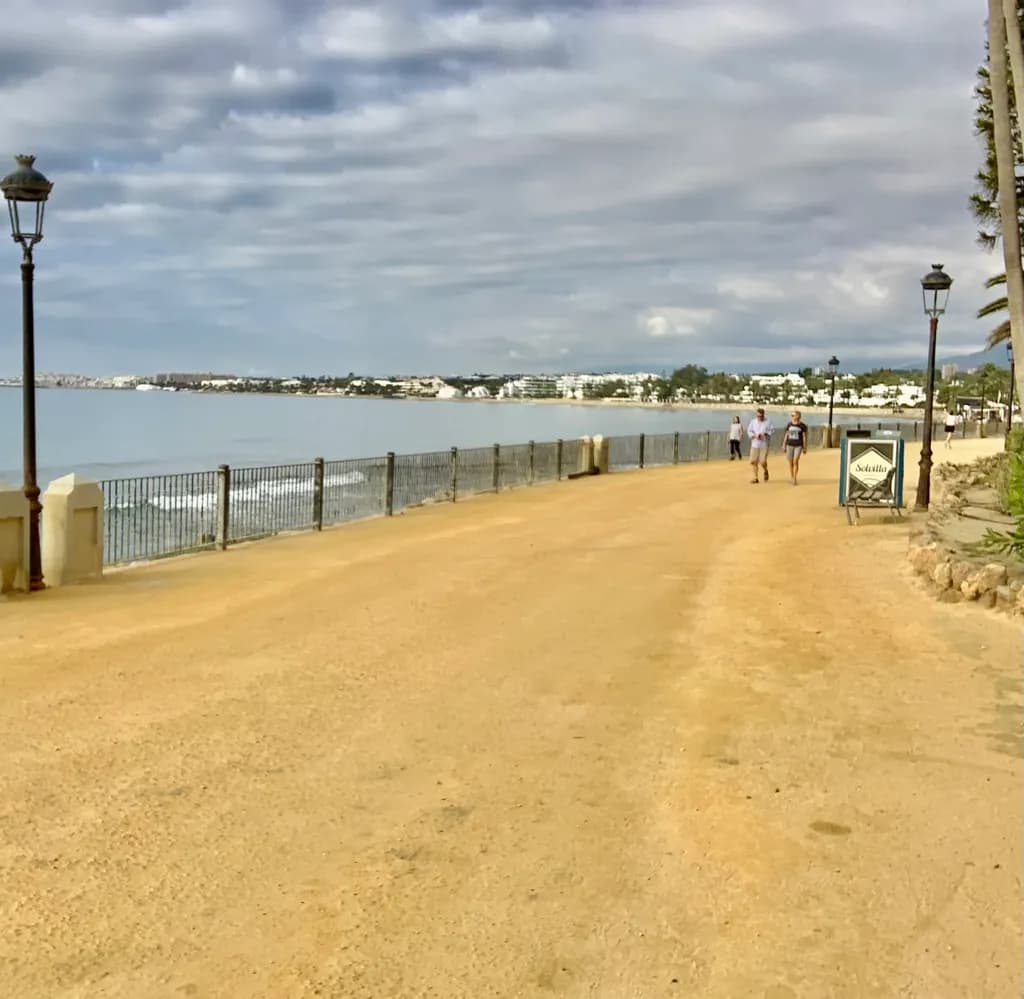 Coastal Serenity: A Tranquil Promenade Under Cloudy Skies