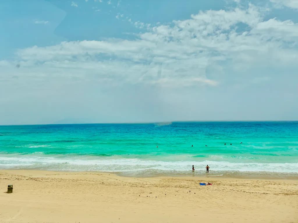 Serenity by the Shore: A Tranquil Beach Escape with Turquoise Waves and Soft Sands