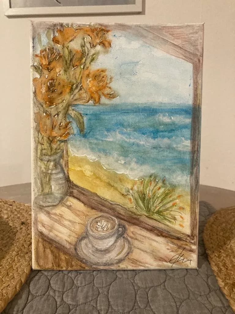 Serenity by the Sea: A Cozy Coffee Moment with Blossoms and Waves