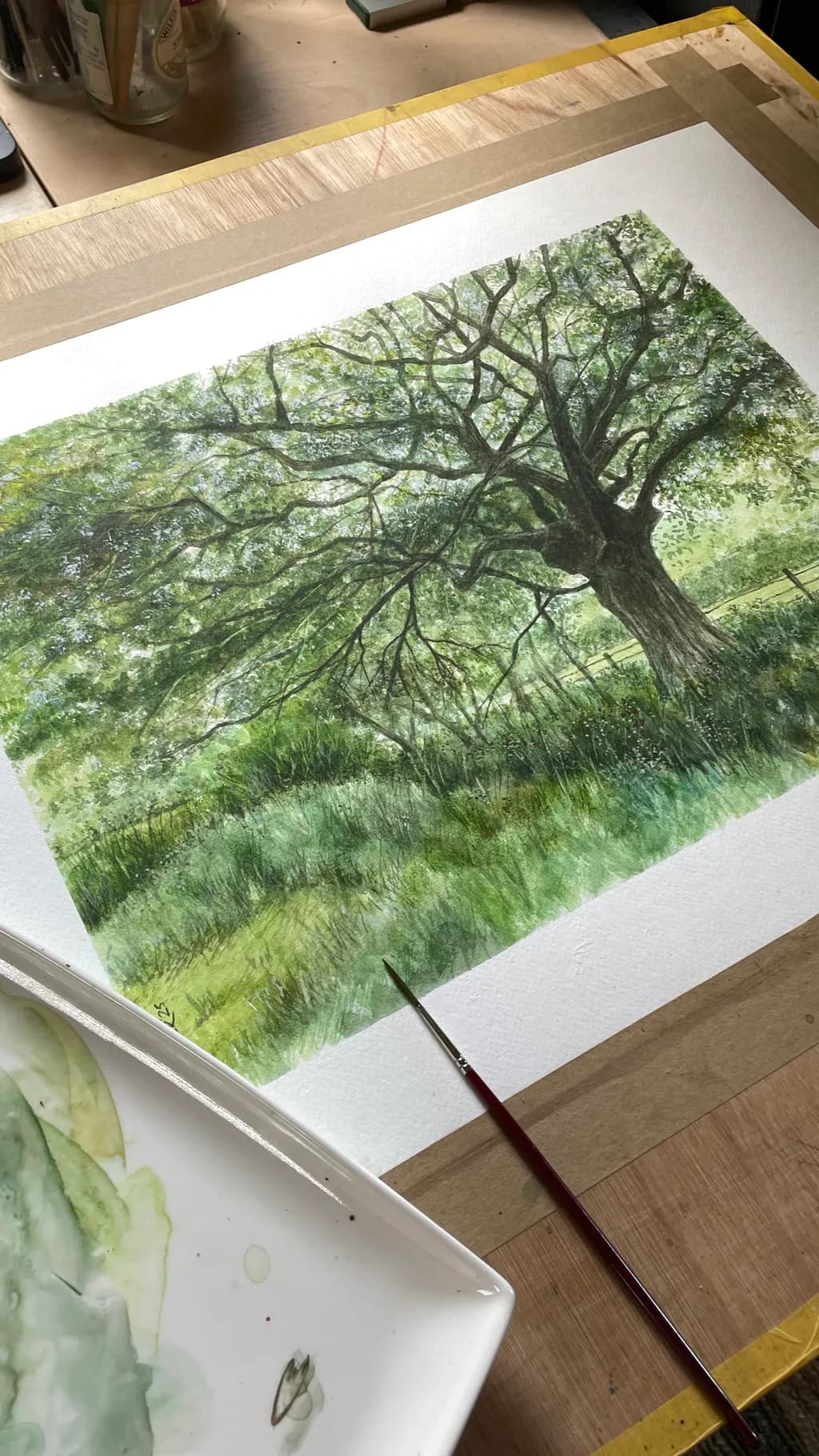 Whispers of Nature: A Serene Tree in Lush Greenery