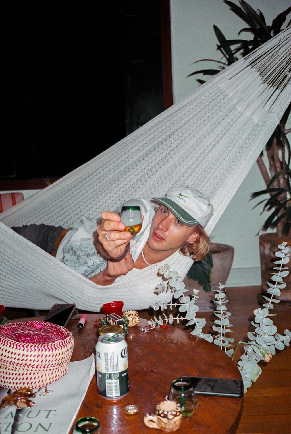 Chill Vibes: A Relaxing Moment in a Hammock Surrounded by Greenery and Good Company