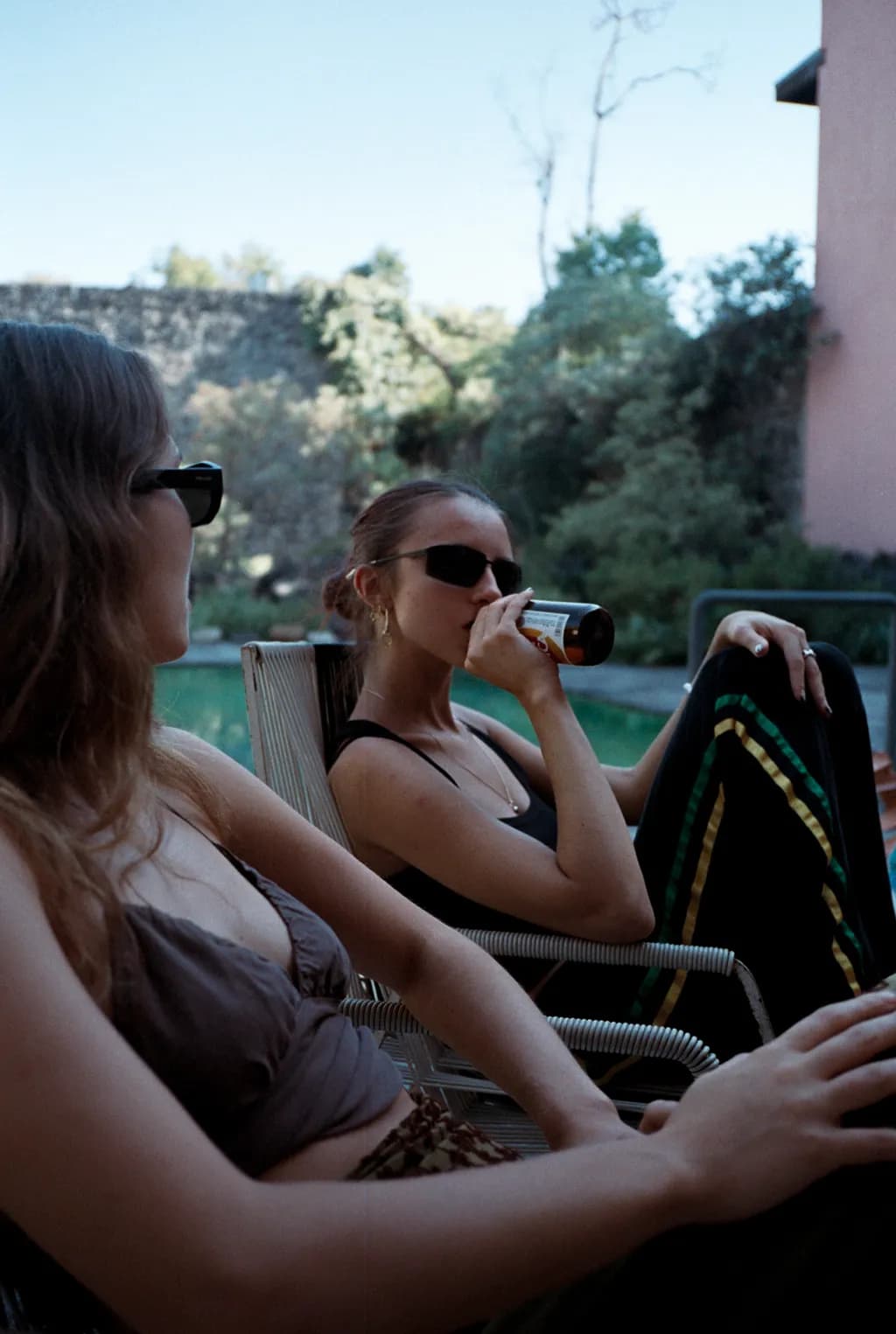 Sunlit Serenity: A Moment of Relaxation and Connection by the Poolside