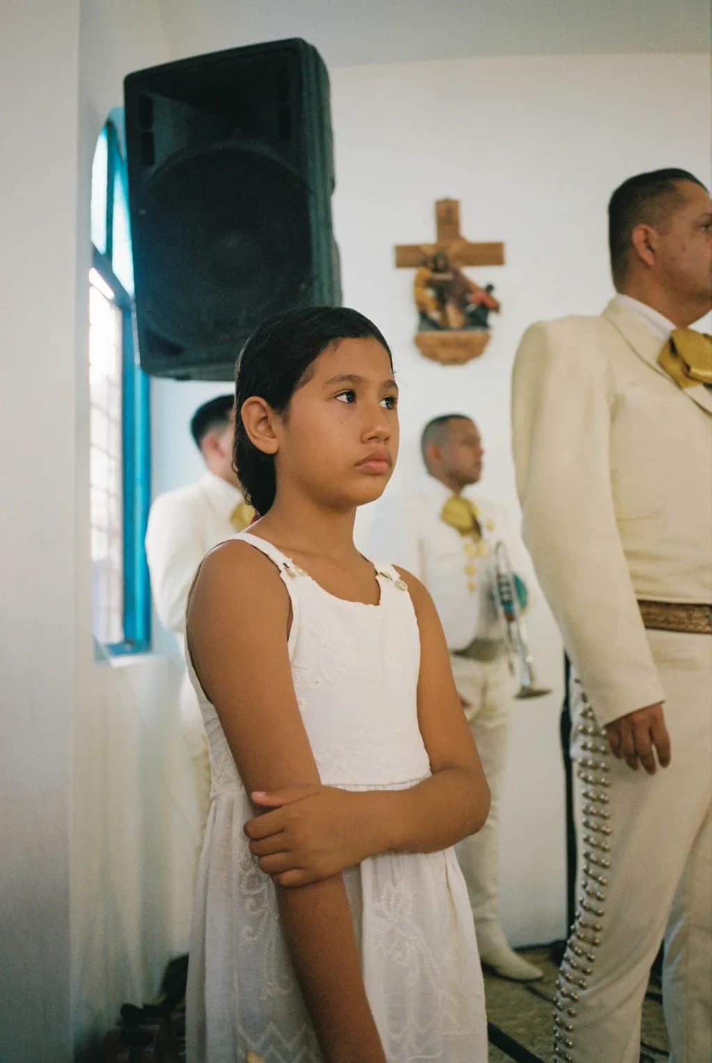 Whispers of Innocence: A Young Girl's Poised Reflection Amidst Celebration