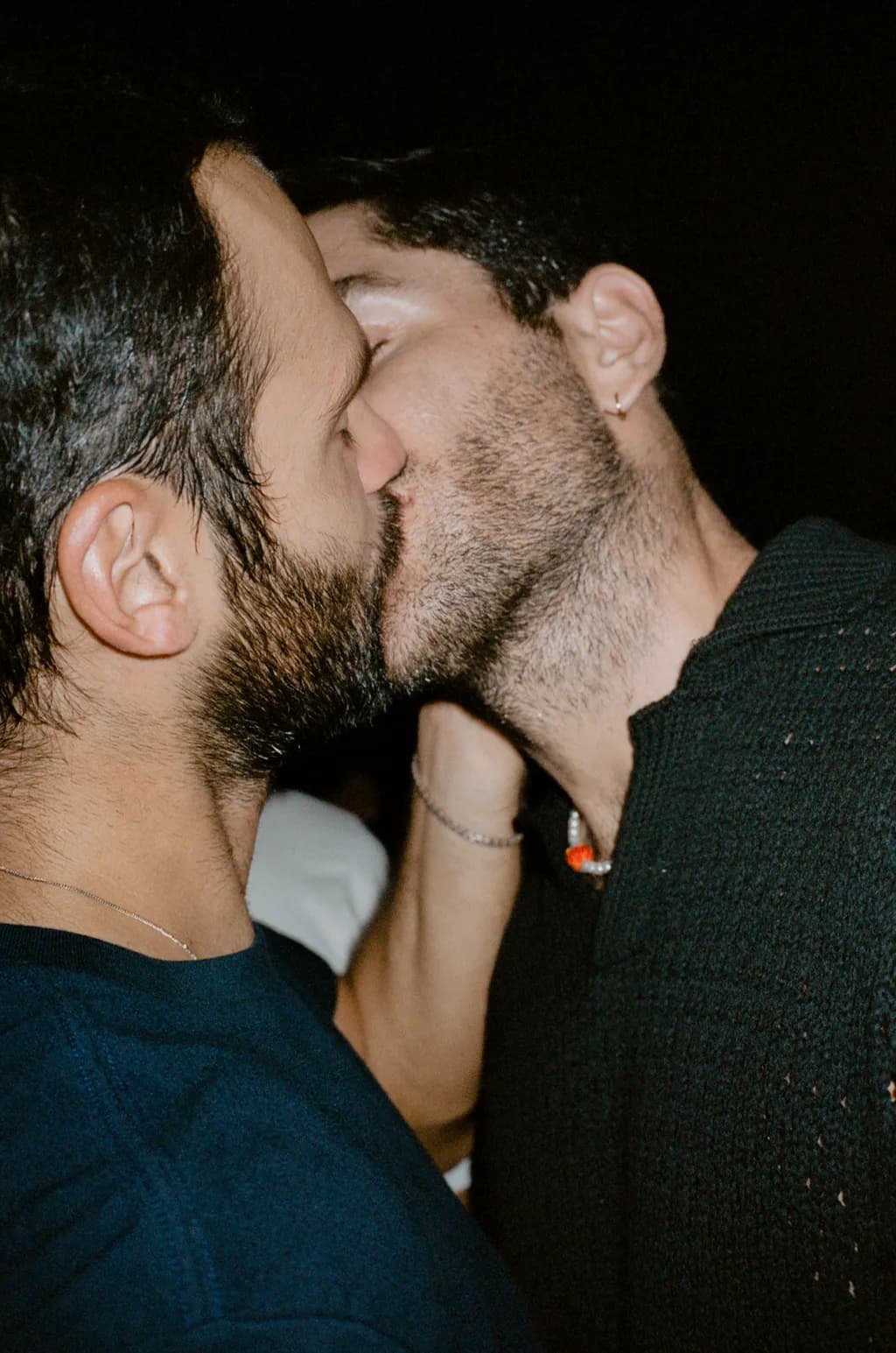 Intimate Moments: A Kiss in the Shadows of Night