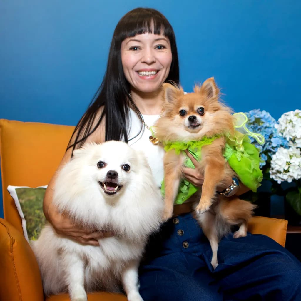 Joyful Companionship: A Heartwarming Portrait of Love and Laughter with Adorable Pomeranians