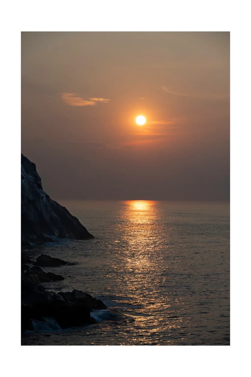 Serenity at Dusk: A Tranquil Sunset Over the Ocean's Embrace