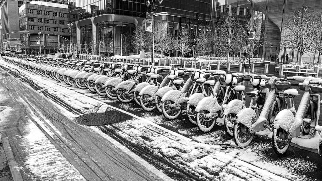 Urban Winter: Monochrome Bicycles Blanketed in Snow