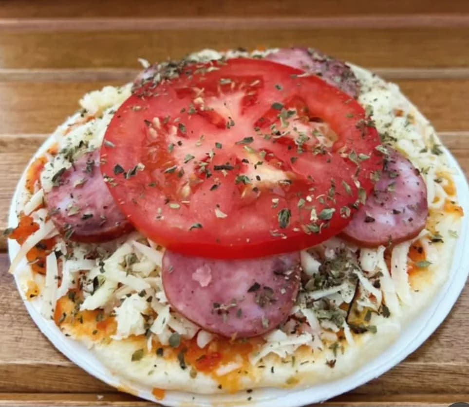 Savory Symphony: A Tomato and Sausage Delight on a Cheesy Canvas