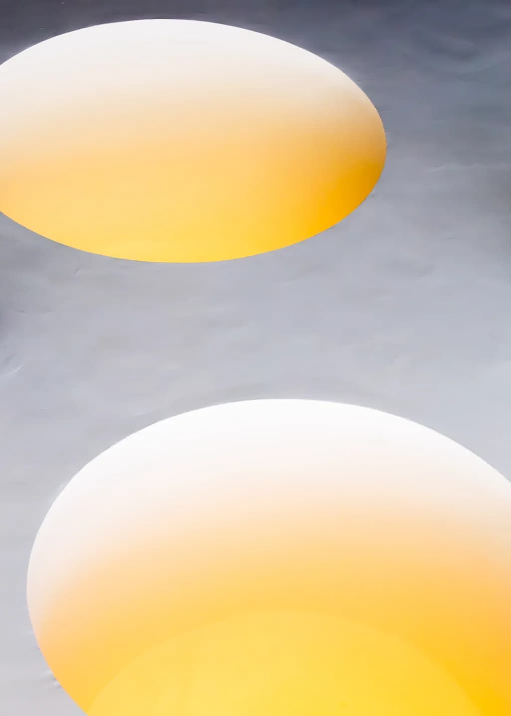 Radiant Orbs: A Dance of Light and Shadow in Yellow and White Gradients