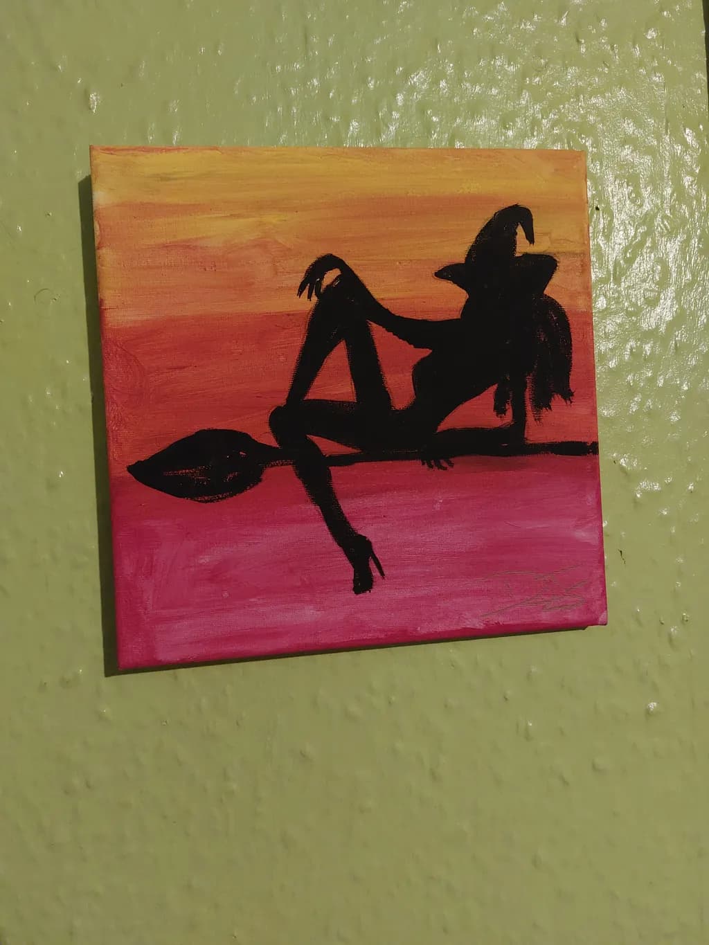 Enchanting Silhouette: A Playful Witch in Colorful Abstract Harmony