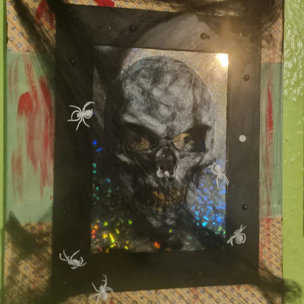Eerie Reflections: A Haunting Skull Surrounded by Shadows and Spiders