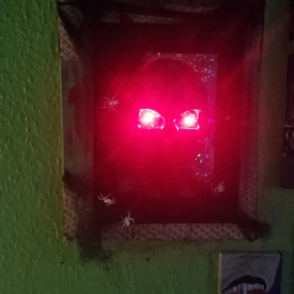Eerie Glow: The Haunted Eyes of the Spider Frame