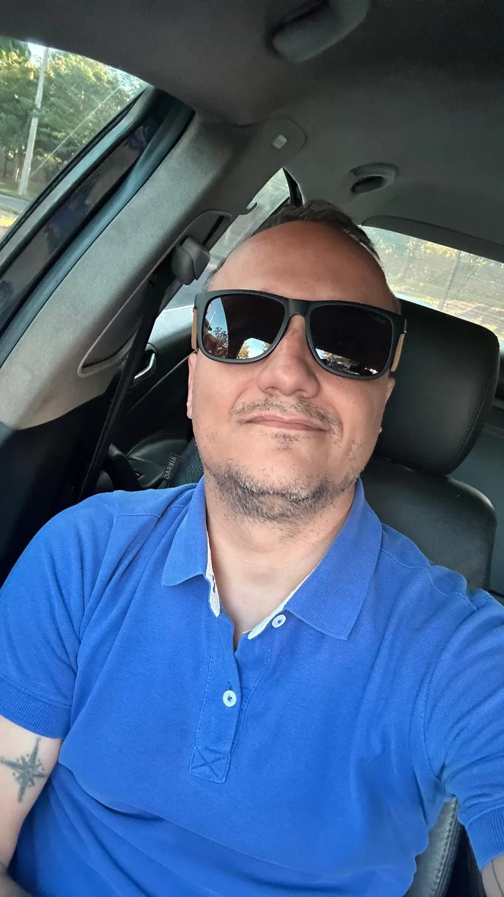 Urban Reflections: A Casual Moment in the Car