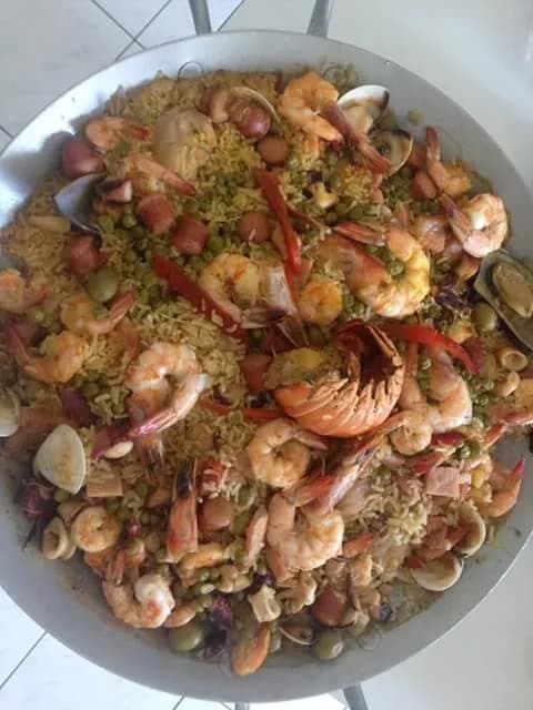 Savor the Spice: A Vibrant Seafood Platter with Aromatic Herbs and Rice Delights