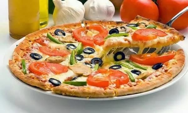 Savor the Slice: A Colorful Medley of Fresh Veggies on Classic Pizza Delight
