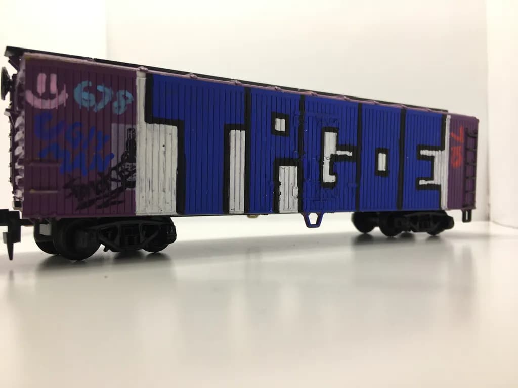 Urban Whimsy: The Colorful Journey of a Graffiti Train Car