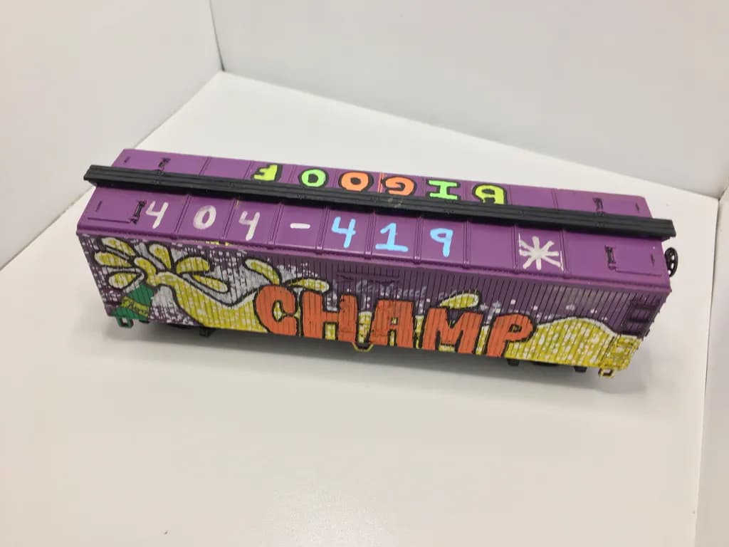 Vibrant Journey: The Purple Graffiti Train Container Adventure
