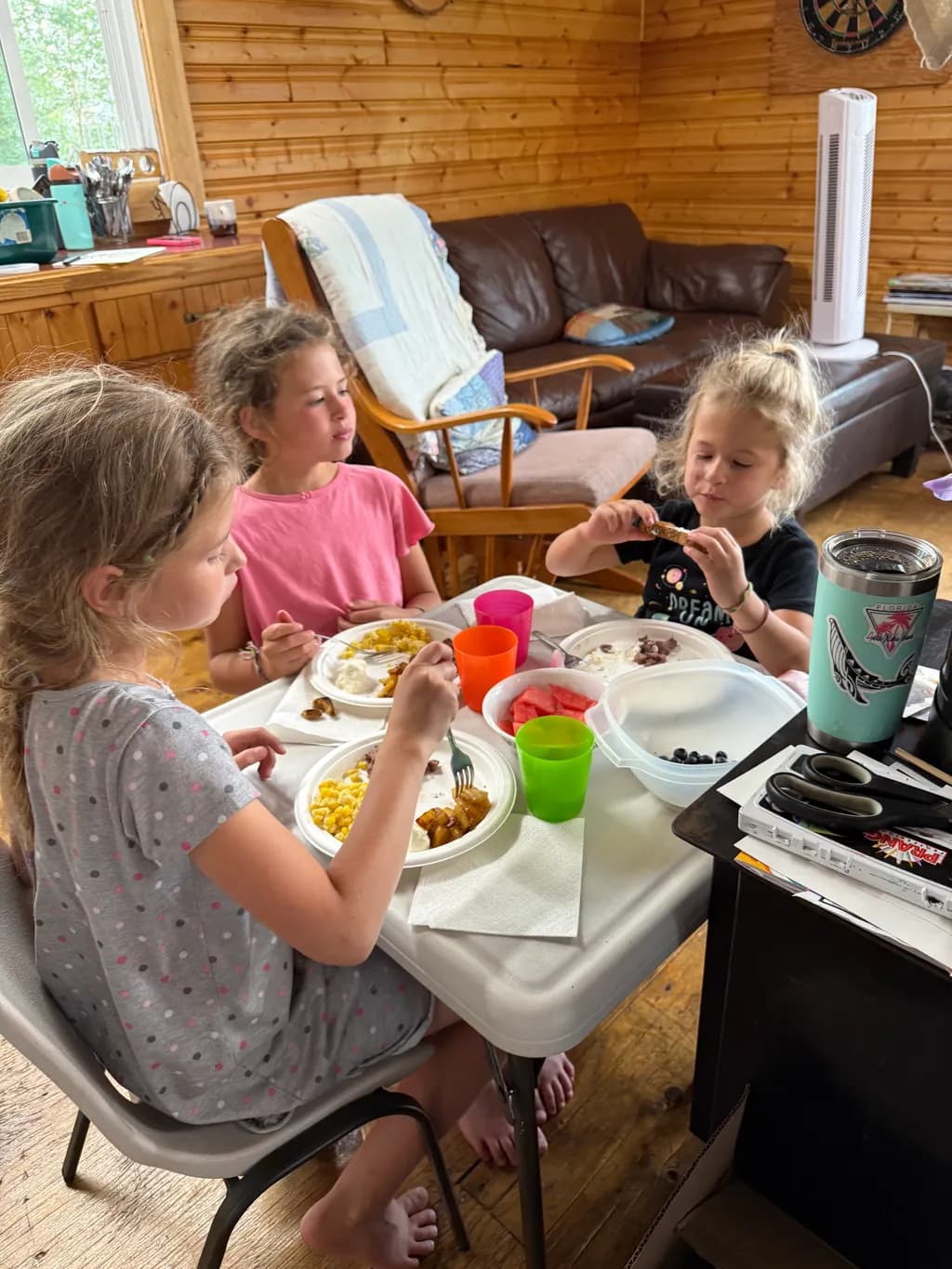 "Joyful Moments: Children Sharing a Meal in a Cozy Cabin"