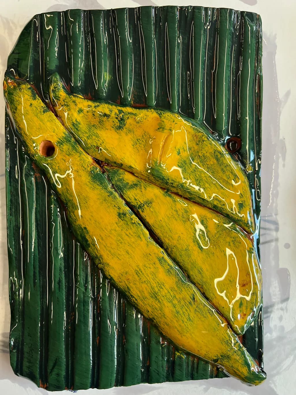 Vibrant Harmony: Yellow Leaves on Lush Green Texture