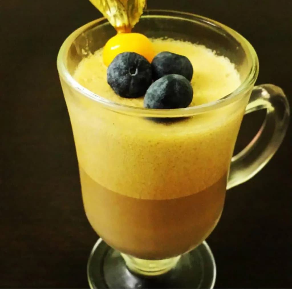 Velvety Chocolate Mousse Delight with Fresh Berries and Golden Garnish