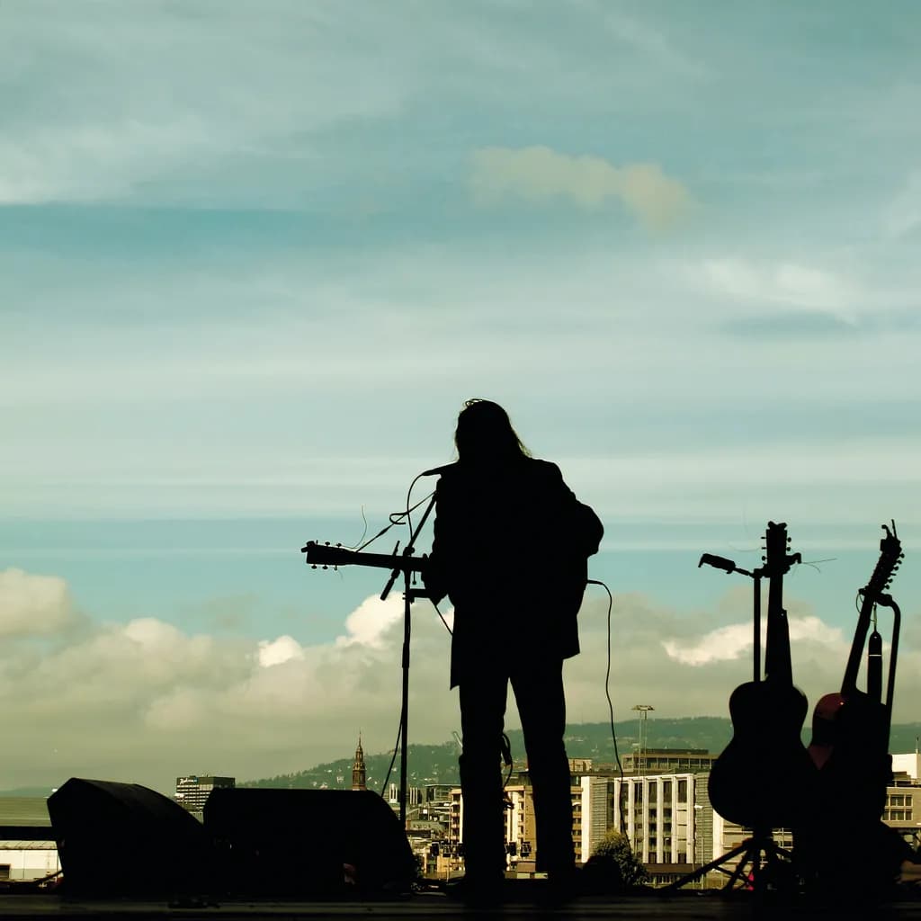 Silhouetted Serenade: A Musician's Dream Against the Urban Skyline