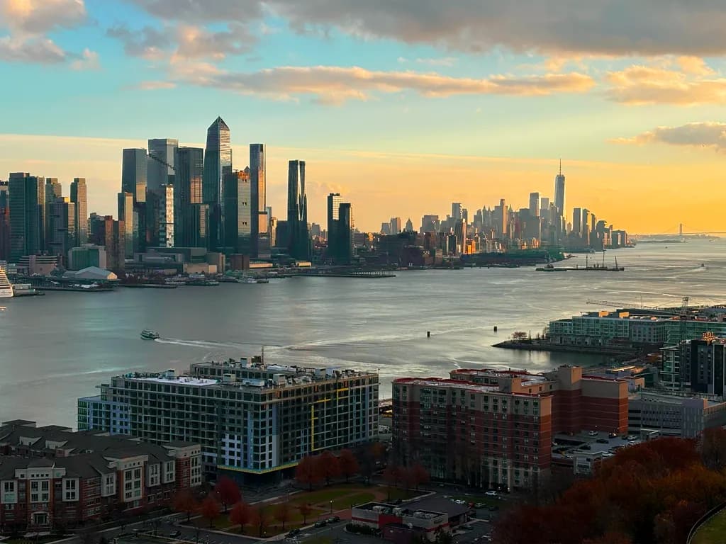 The Vibrant Pulse of the City- Sunset Over the New York Skyline and Hudson River