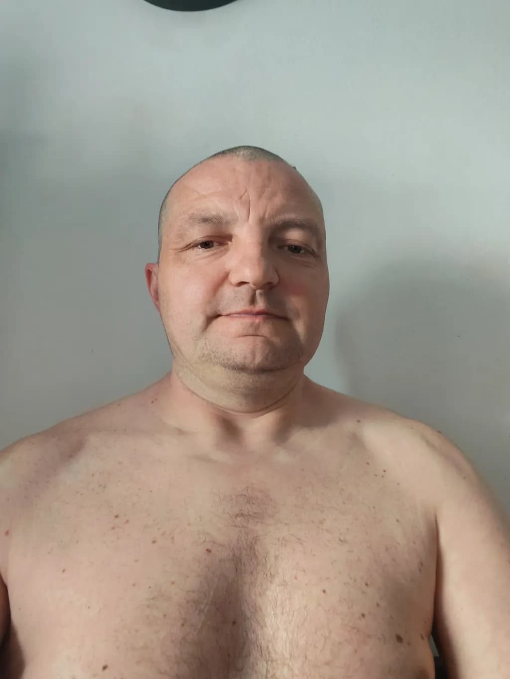 Casual Introspection: A Shirtless Portrait of Everyday Life