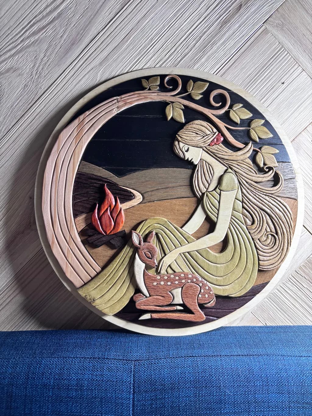 Whimsical Serenity: A Wood Sculpture of Nature's Embrace with a Girl and Fawn